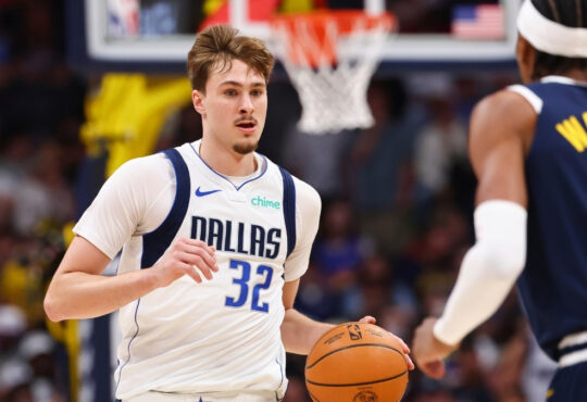 Cooper Flagg of the Dallas Mavericks controls the ball against the Denver Nuggets in the second quarter at Ball Arena on March 25, 2026.