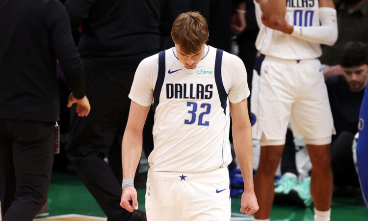 Cooper Flagg exits the huddle during a first-quarter timeout against the Boston Celtics at TD Garden on March 6, 2026