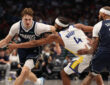Dallas Mavericks rookie Cooper Flagg drives against Moses Moody of the Golden State Warriors during the third quarter at American Airlines Center on March 23, 2026.