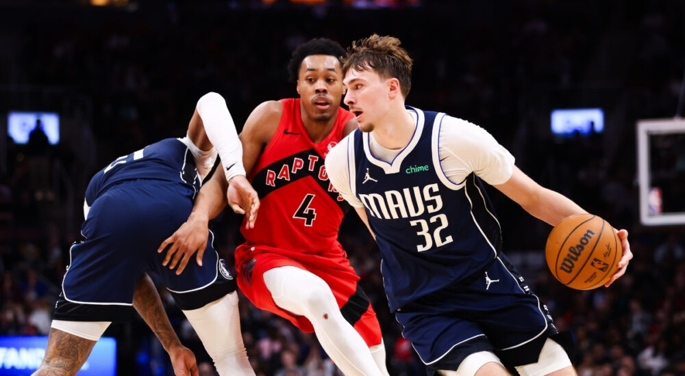 Cooper Flagg #32 of the Dallas Mavericks drives to the basket against Scottie Barnes #4 of the Toronto Raptors at Scotiabank Arena on March 8, 2026.