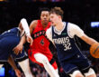 Cooper Flagg #32 of the Dallas Mavericks drives to the basket against Scottie Barnes #4 of the Toronto Raptors at Scotiabank Arena on March 8, 2026.