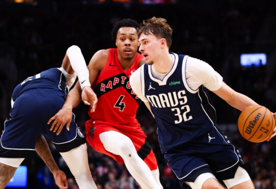 Cooper Flagg #32 of the Dallas Mavericks drives to the basket against Scottie Barnes #4 of the Toronto Raptors at Scotiabank Arena on March 8, 2026.