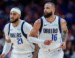 Daniel Gafford and Caleb Martin of the Dallas Mavericks look on during a game against the Charlotte Hornets at Spectrum Center on March 3, 2026.