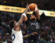 Daniel Gafford (#21) of the Dallas Mavericks shoots over Julius Randle (#30) of the Minnesota Timberwolves during the second half at American Airlines Center.