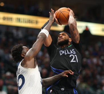 Daniel Gafford (#21) of the Dallas Mavericks shoots over Julius Randle (#30) of the Minnesota Timberwolves during the second half at American Airlines Center.