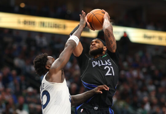 Daniel Gafford (#21) of the Dallas Mavericks shoots over Julius Randle (#30) of the Minnesota Timberwolves during the second half at American Airlines Center.