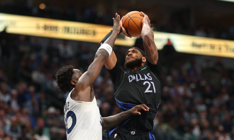 Daniel Gafford (#21) of the Dallas Mavericks shoots over Julius Randle (#30) of the Minnesota Timberwolves during the second half at American Airlines Center.