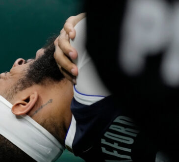 Daniel Gafford of the Dallas Mavericks reacts to a right shoulder injury during the second quarter against the Milwaukee Bucks at Fiserv Forum.