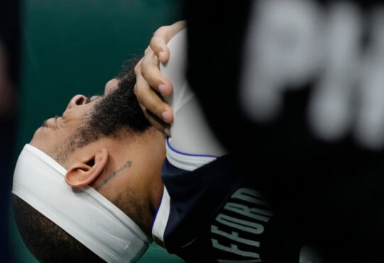 Daniel Gafford of the Dallas Mavericks reacts to a right shoulder injury during the second quarter against the Milwaukee Bucks at Fiserv Forum.