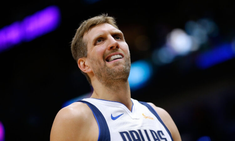 Dirk Nowitzki of the Dallas Mavericks wearing a blue away jersey and reacting during a game against the New Orleans Pelicans at Smoothie King Center.