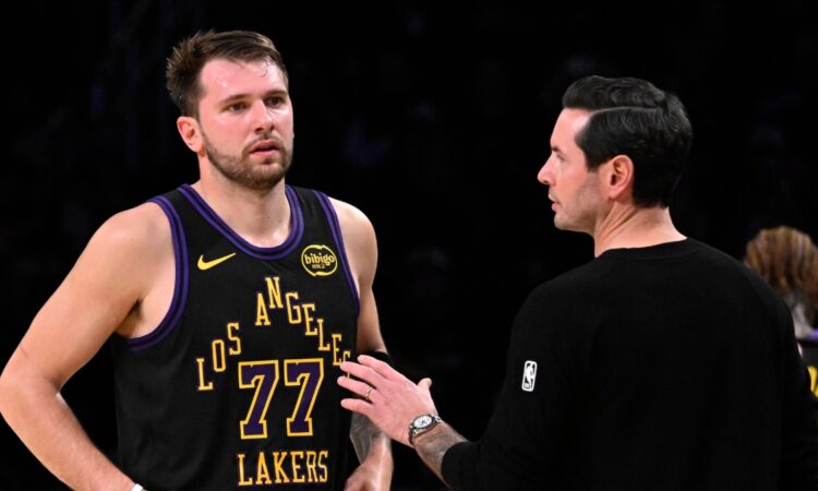 Los Angeles Lakers head coach JJ Redick talks with Luka Dončić during a game against the Utah Jazz at Crypto.com Arena on November 18, 2025.