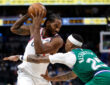 Kawhi Leonard looks toward the basket as P.J. Washington defends during overtime of the Clippers’ game against the Mavericks on March 21, 2026 at American Airlines Center.
