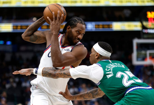 Kawhi Leonard looks toward the basket as P.J. Washington defends during overtime of the Clippers’ game against the Mavericks on March 21, 2026 at American Airlines Center.