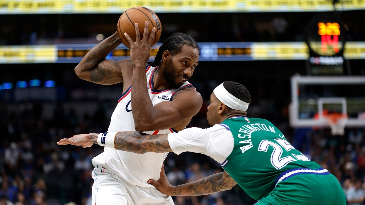 Kawhi Leonard looks toward the basket as P.J. Washington defends during overtime of the Clippers’ game against the Mavericks on March 21, 2026 at American Airlines Center.