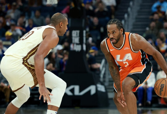 Kawhi Leonard of the LA Clippers drives toward the basket while being guarded by Al Horford of the Golden State Warriors at Chase Center.