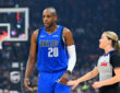 Khris Middleton talks with referee Jenna Schroeder during the first quarter of the Mavericks’ game against the Cleveland Cavaliers at Rocket Mortgage FieldHouse on March 15, 2026.