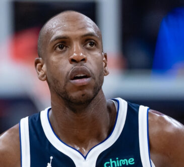 NBA: Khris Middleton jogs up court for the Dallas Mavericks during a game against the Indiana Pacers at Gainbridge Fieldhouse.