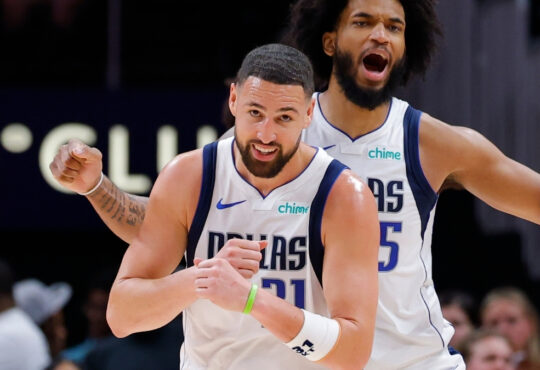 Klay Thompson #31 reacts with Marvin Bagley III #35 of the Dallas Mavericks during the fourth quarter at State Farm Arena.