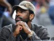 Kyrie Irving of the Dallas Mavericks attending the UConn Huskies vs. Notre Dame Fighting Irish Elite Eight game at the 2026 NCAA Women's Basketball Tournament.