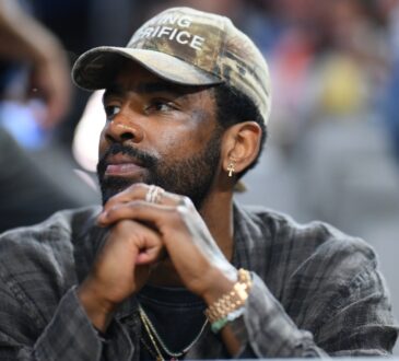 Kyrie Irving of the Dallas Mavericks attending the UConn Huskies vs. Notre Dame Fighting Irish Elite Eight game at the 2026 NCAA Women's Basketball Tournament.