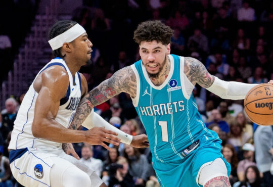 NBA: LaMelo Ball brings the ball up court for the Charlotte Hornets while guarded by Brandon Williams of the Dallas Mavericks during a game at Spectrum Center.