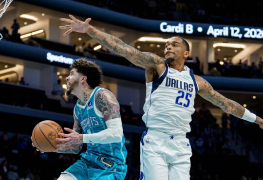 NBA: LaMelo Ball drives to the basket for the Charlotte Hornets while guarded by P.J. Washington of the Dallas Mavericks at Spectrum Center.