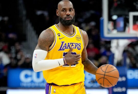 LeBron James #23 of the Los Angeles Lakers dribbles the ball against the Detroit Pistons at Little Caesars Arena on March 23, 2026.