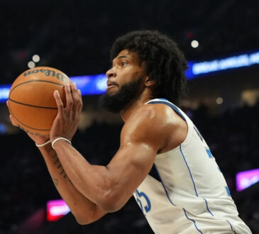 Marvin Bagley III #35 of the Dallas Mavericks prepares to shoot a jumper against the Portland Trail Blazers at Moda Center.