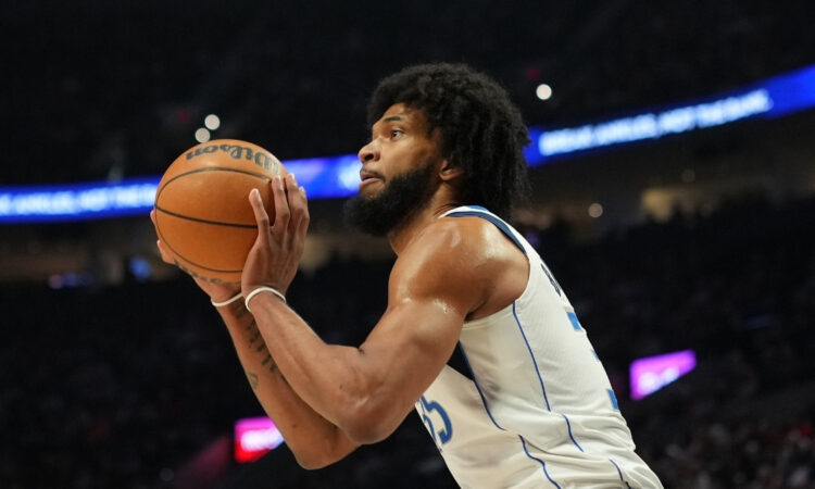 Marvin Bagley III #35 of the Dallas Mavericks prepares to shoot a jumper against the Portland Trail Blazers at Moda Center.