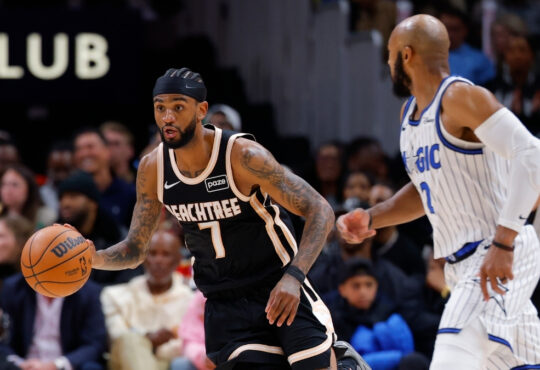 Nickeil Alexander-Walker drives against Jevon Carter during Hawks vs. Magic on March 16, 2026 at State Farm Arena.
