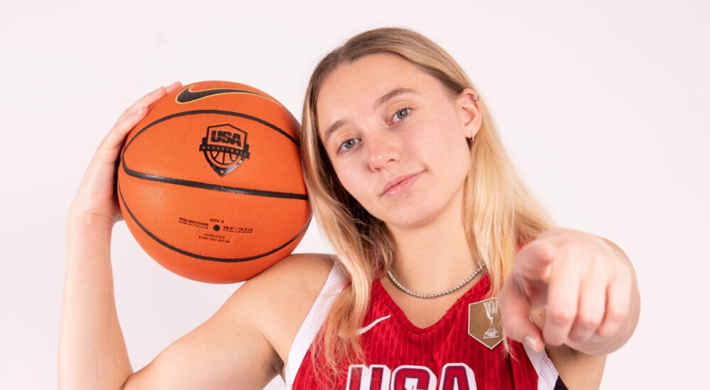 Paige Bueckers holds a basketball while posing in her USA Basketball uniform ahead of the 2026 FIBA Women's World Cup Qualifying Tournament in Puerto Rico.