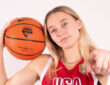 Paige Bueckers holds a basketball while posing in her USA Basketball uniform ahead of the 2026 FIBA Women's World Cup Qualifying Tournament in Puerto Rico.