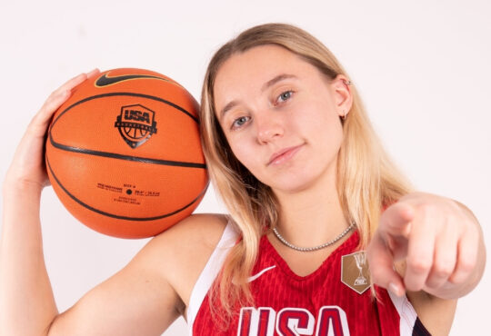 Paige Bueckers holds a basketball while posing in her USA Basketball uniform ahead of the 2026 FIBA Women's World Cup Qualifying Tournament in Puerto Rico.