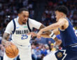 P.J. Washington (#25) of the Dallas Mavericks drives to the basket against the Denver Nuggets during the first quarter at Ball Arena.
