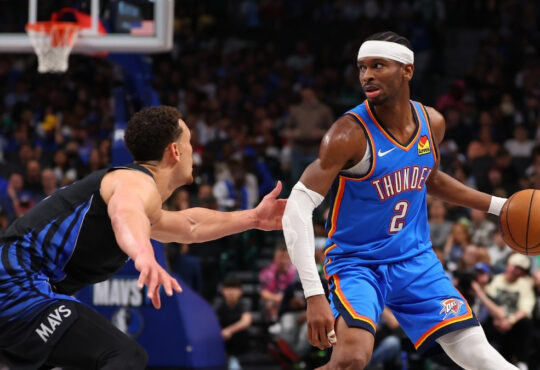 NBA: Shai Gilgeous-Alexander drives to the basket while defended by Dwight Powell at American Airlines Center during Thunder vs. Mavericks.