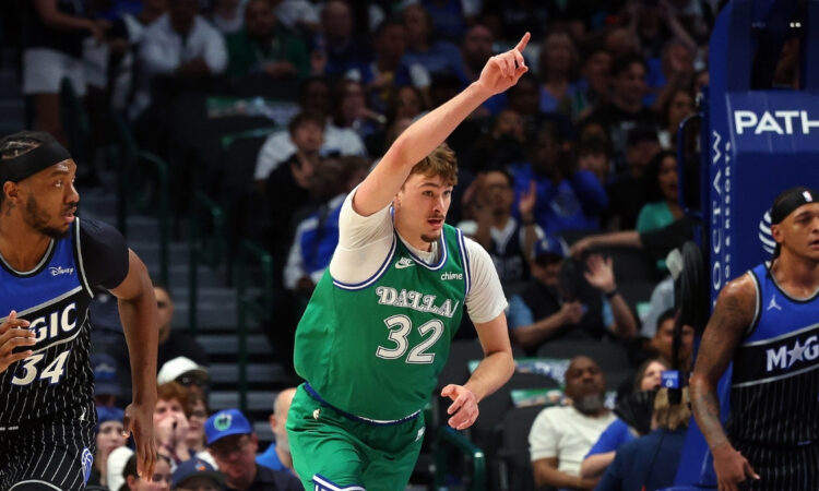 Cooper Flagg #32 of the Dallas Mavericks celebrates a shot during a career-high 51-point game against the Orlando Magic at American Airlines Center.