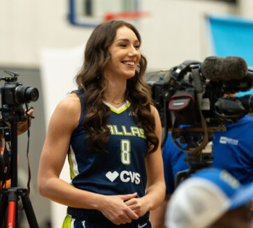 Dallas Wings forward Alanna Smith asks a question to teammate Alysha Clark during a media availability session.