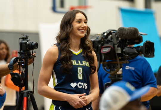 Dallas Wings forward Alanna Smith asks a question to teammate Alysha Clark during a media availability session.