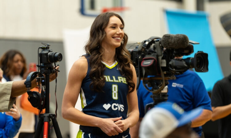 Dallas Wings forward Alanna Smith asks a question to teammate Alysha Clark during a media availability session.