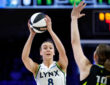 Alanna Smith #8 of the Minnesota Lynx looks to pass the ball while guarded by the Dallas Wings at College Park Center.