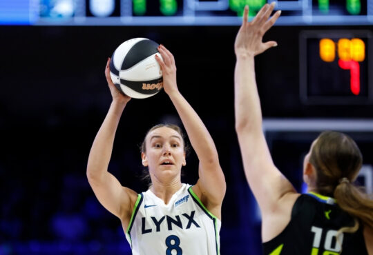 Alanna Smith #8 of the Minnesota Lynx looks to pass the ball while guarded by the Dallas Wings at College Park Center.