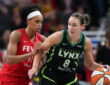 Minnesota Lynx forward Alanna Smith handles the ball against Indiana Fever's Brianna Turner in Indianapolis.