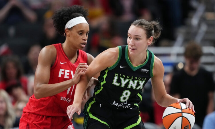 Minnesota Lynx forward Alanna Smith handles the ball against Indiana Fever's Brianna Turner in Indianapolis.