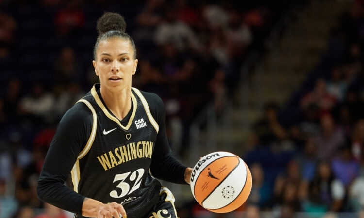 Alysha Clark #32 of the Washington Mystics dribbles against the Golden State Valkyries during a game in Washington, DC.