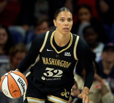 Alysha Clark #32 of the Washington Mystics dribbles the ball during a game against the Connecticut Sun in Washington, DC.