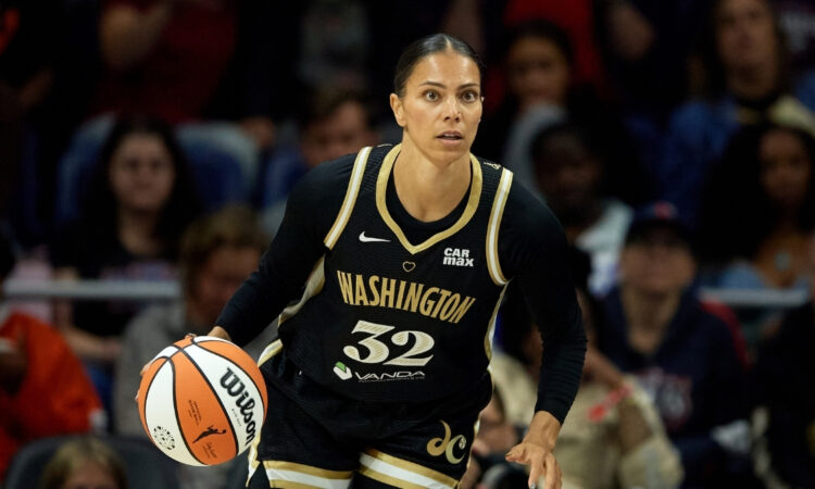 Alysha Clark #32 of the Washington Mystics dribbles the ball during a game against the Connecticut Sun in Washington, DC.