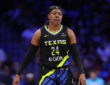Arike Ogunbowale #24 of the Dallas Wings looking on during the second half against the Washington Mystics at College Park Center.