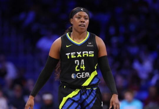 Arike Ogunbowale #24 of the Dallas Wings looking on during the second half against the Washington Mystics at College Park Center.