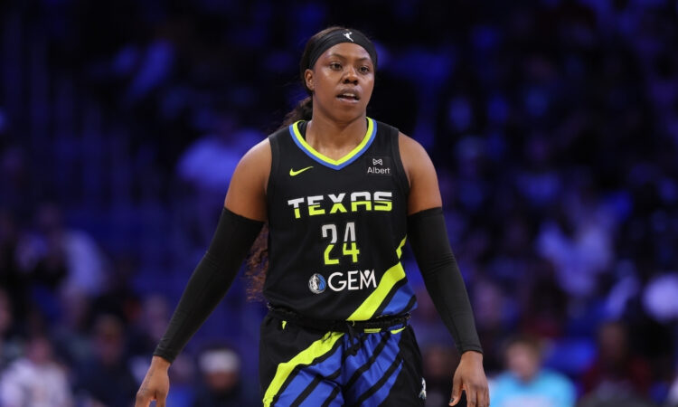 Arike Ogunbowale #24 of the Dallas Wings looking on during the second half against the Washington Mystics at College Park Center.