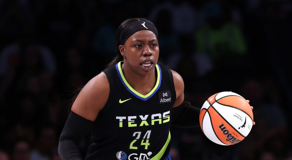 Arike Ogunbowale #24 of the Dallas Wings handles the ball during the first half against the New York Liberty at Barclays Center.